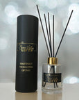 Luxury reed diffuser with black reeds in elegant gift packaging