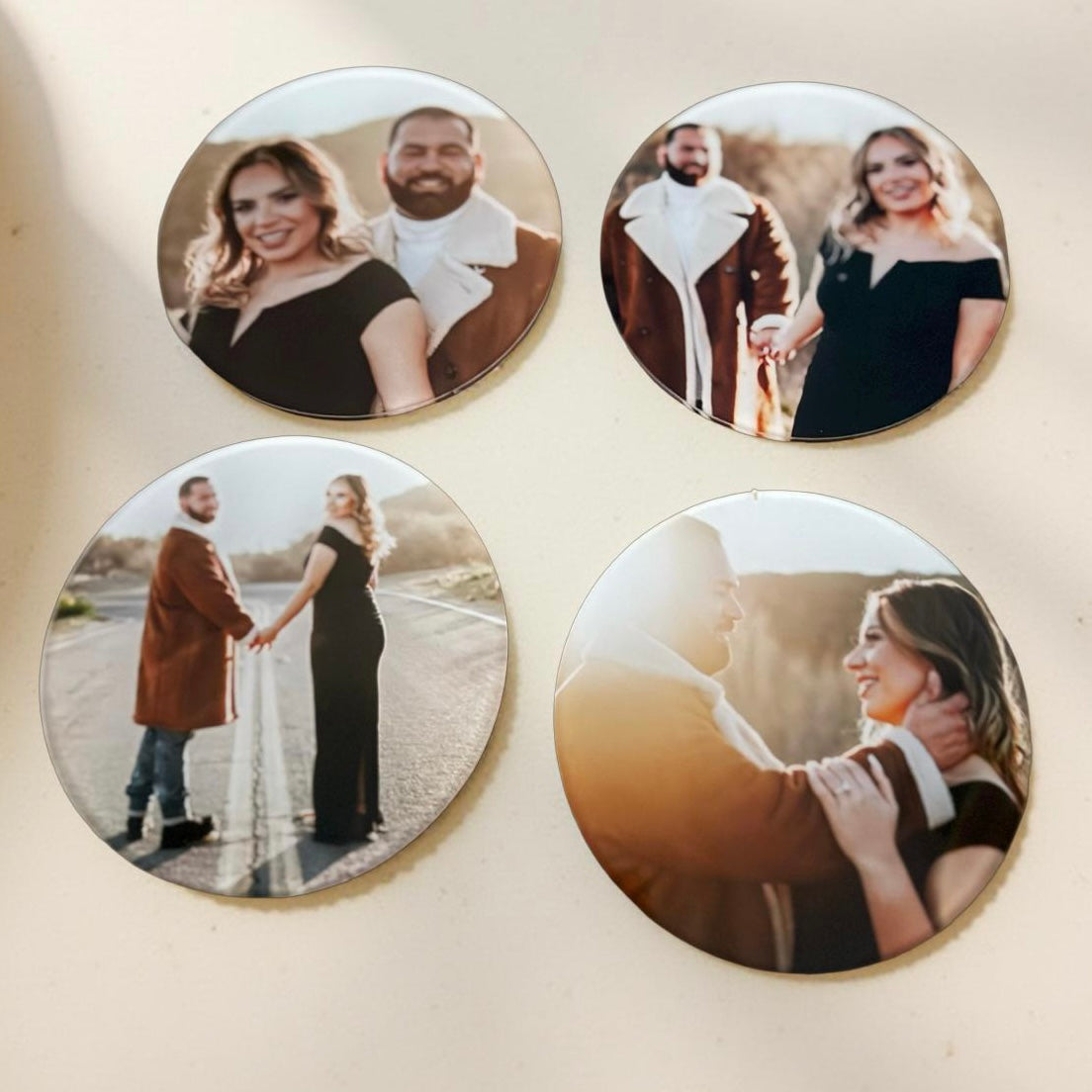 Custom acrylic photo coasters with cork backing on table