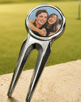 Golf divot tool with a photo