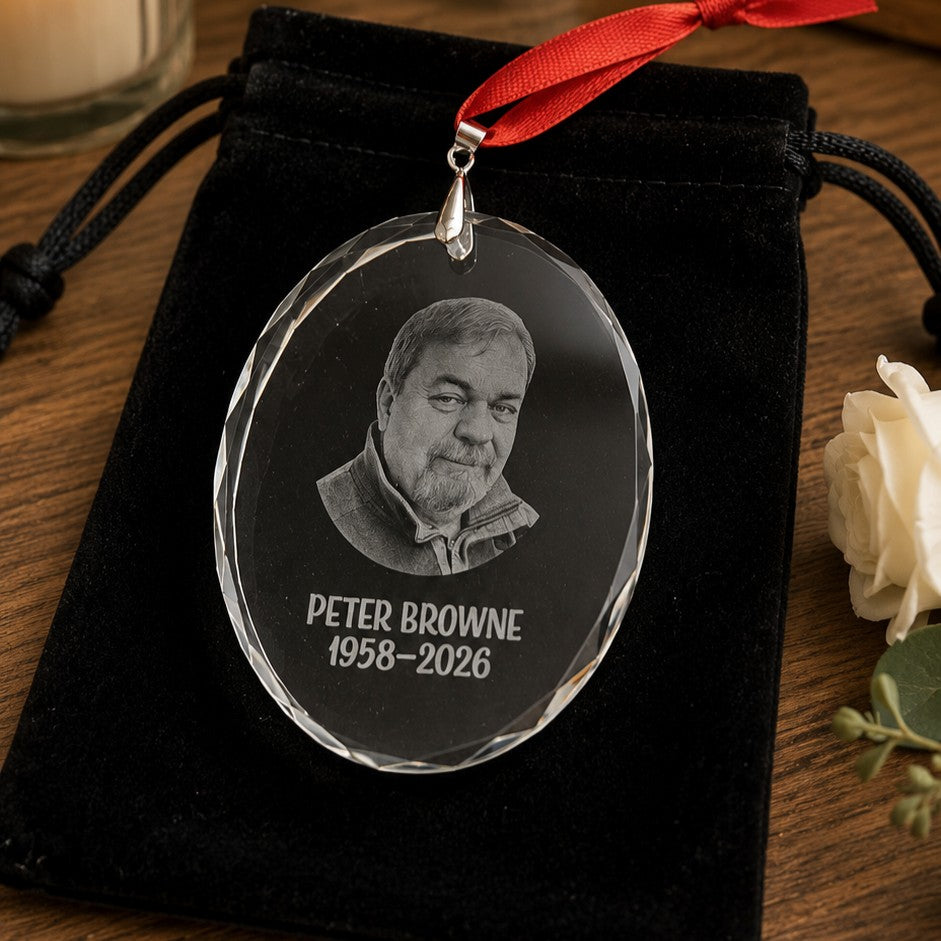 Personalised memorial glass ornament presented in a black velvet gift bag
