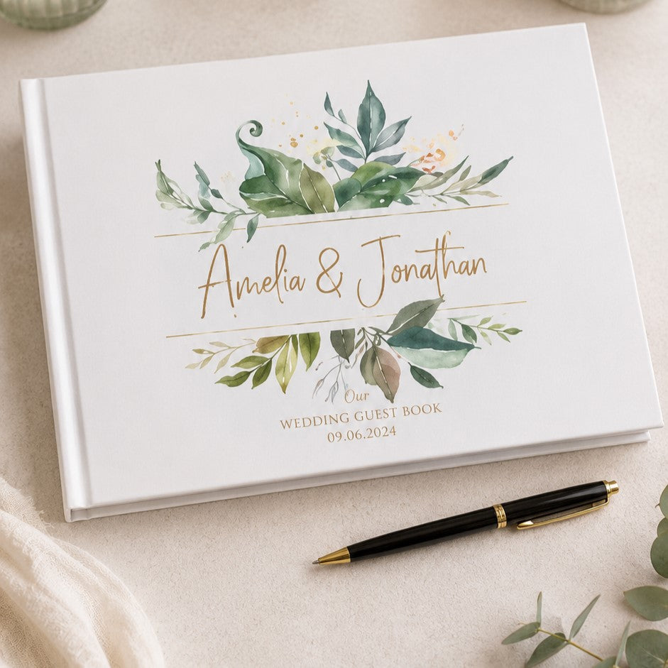 personalized white wedding guest book with a watercolor green leaf design 