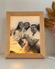 Custom LED photo frame printed on clear acrylic with warm glow
