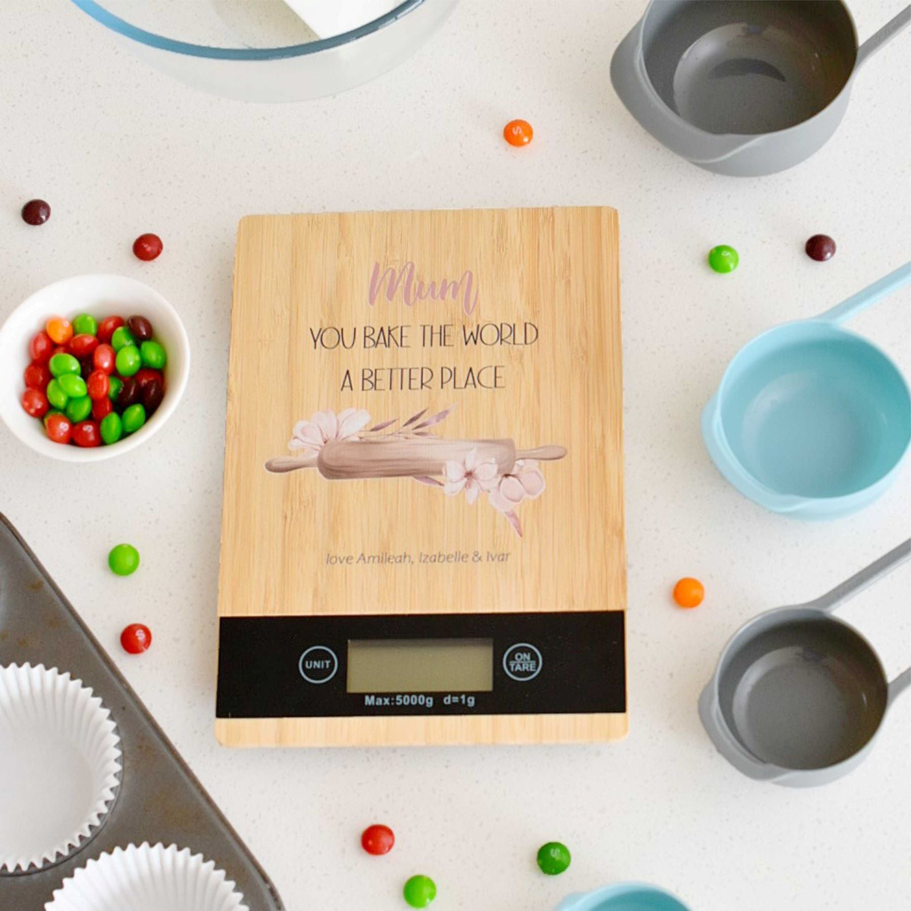 kitchen scales with “You Bake the World a Better Place” quote, black LCD display and stand